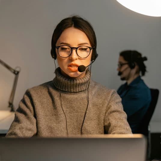 Woman with headset providing live support